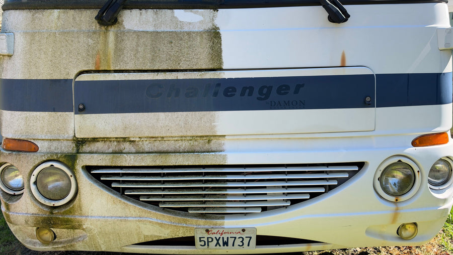 2004 Damon Challenger 335 front shown as a 50/50, with mould and oxidation on the left half and the cut, polished and ceramic coated finish on the right