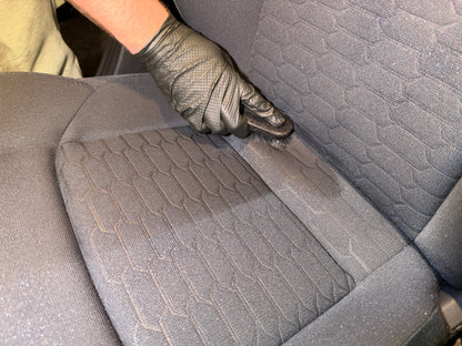 Interior ceramic coating being worked into the fabric seats