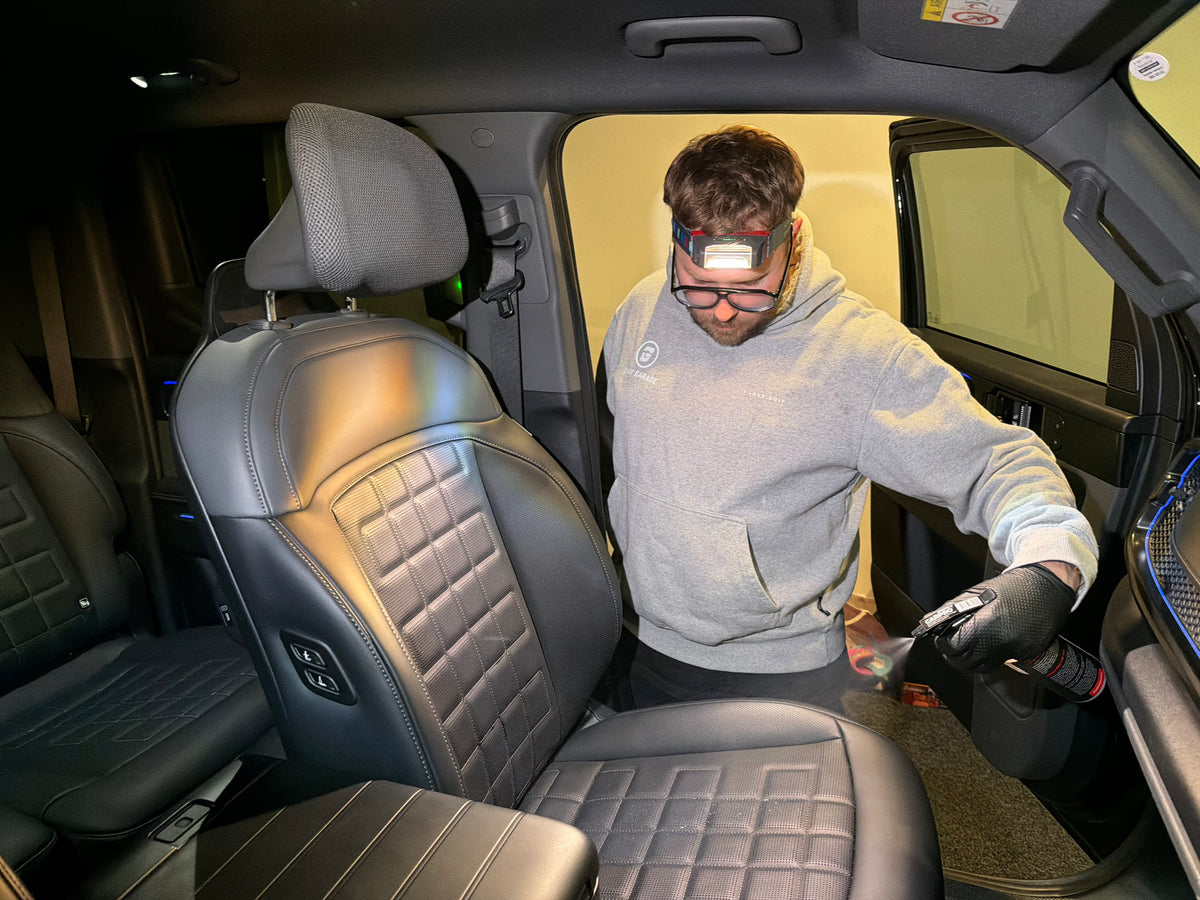 Interior ceramic coating being applied to the leather seats