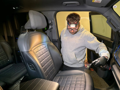 Interior ceramic coating being applied to the leather seats
